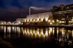 illuminated building on the river bank in Sweden