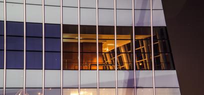 Building with the windows, and colorful light inside