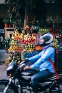 Fruits market and Man bike