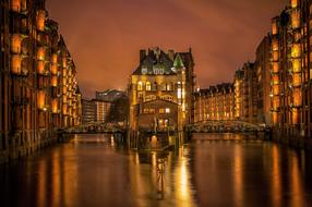 yellow illumination of houses near the river