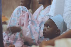 funny african baby boy in blue cap