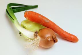 Fresh delicious vegetables on a white background