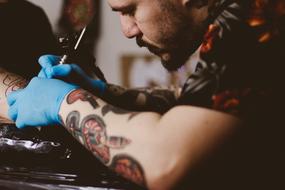Hand Glove man tattooist
