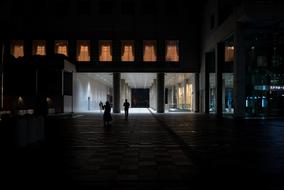 photo of people in a dark supermarket