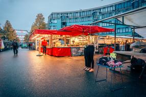 red shop in the city market at dusk