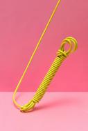 photo of yellow wire on pink background