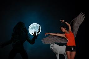girl with wolf on the background of the moon at night