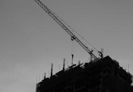 bottom view of a construction site with a crane