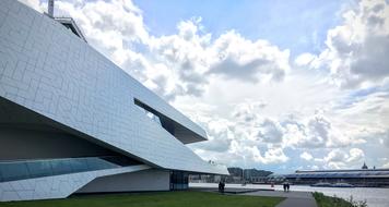 white clouds over the building of modern architecture