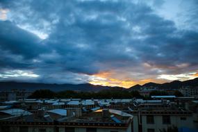 photo of roofs of low-rise buildings at dusk