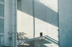 industrial ventilation pipes and building facade