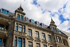 blue sky with white clouds above the building