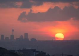 cloudy sunset over modern city