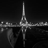 eiffel tower at night in reflection