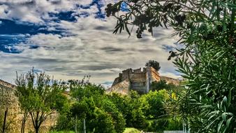 medieval fort near green trees in italy