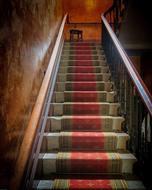 carpet covered Stairs in old building