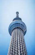 Low angle shot of the tower in Tokyo, Japan, under the blue and white, gradient sky