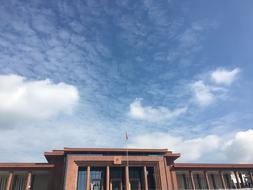 Building at cloudy Blue Sky