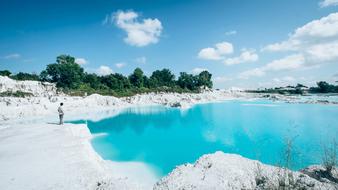 lonely man on the turquoise ocean