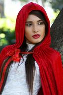 photo of a girl in a red scarf near a tree