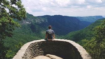 Guy stone balconyand forest