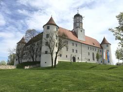 green grass around the castle with towers