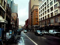 Street with the cars, among the colorful buildings, after the rain, in Seattle, USA