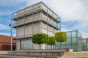 Design of the film academy, with the green trees, in Ludwigsburg, Germany, under the blue sky with clouds