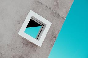 small square window in a concrete building