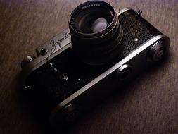 vintage camera on brown surface close up