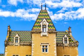 Beautiful and colorful city hall at blue sky with white clouds background in Meursault, Bourgogne, France