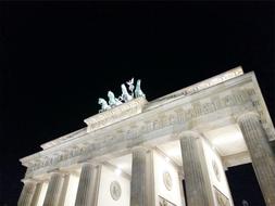 white triumphal gate at night