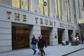 people walking along the trump building in city, usa, Manhattan, Nyc