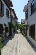 narrow road among residential buildings