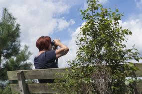 woman photographer on bench