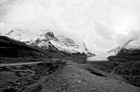 clouds over scenic snow-capped mountain peaks, Background