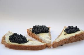 Black caviar and butter on bread