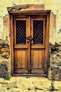 broken wall and wooden Door of Old House