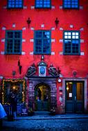 old house with red facade and blue windows in Stockholm