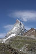 white mountain with a blue sky