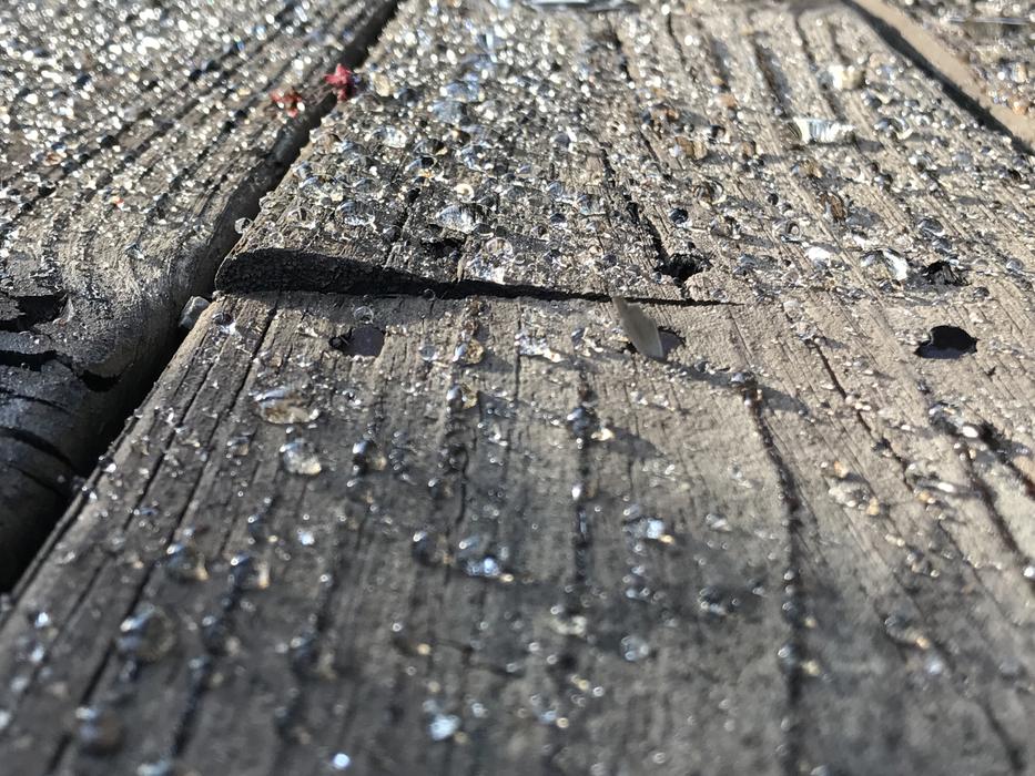 small beads on planks on deck
