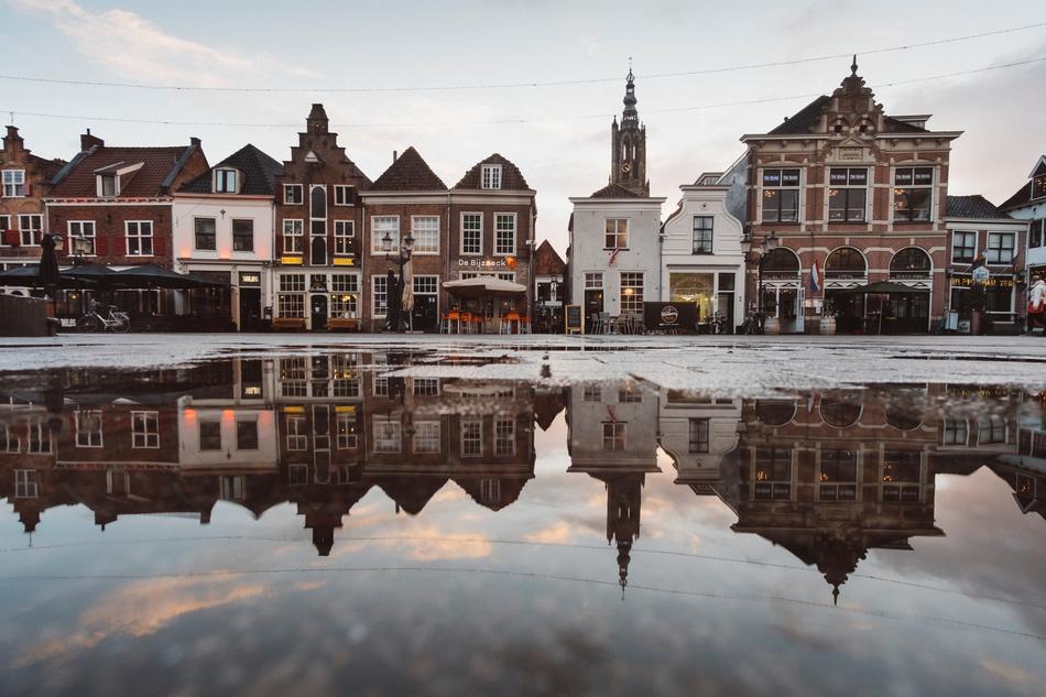 Beautiful and colorful buildings, on the shore, with the reflections