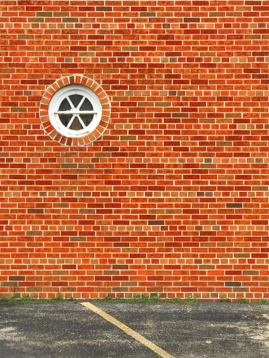 Round window on a brick wall