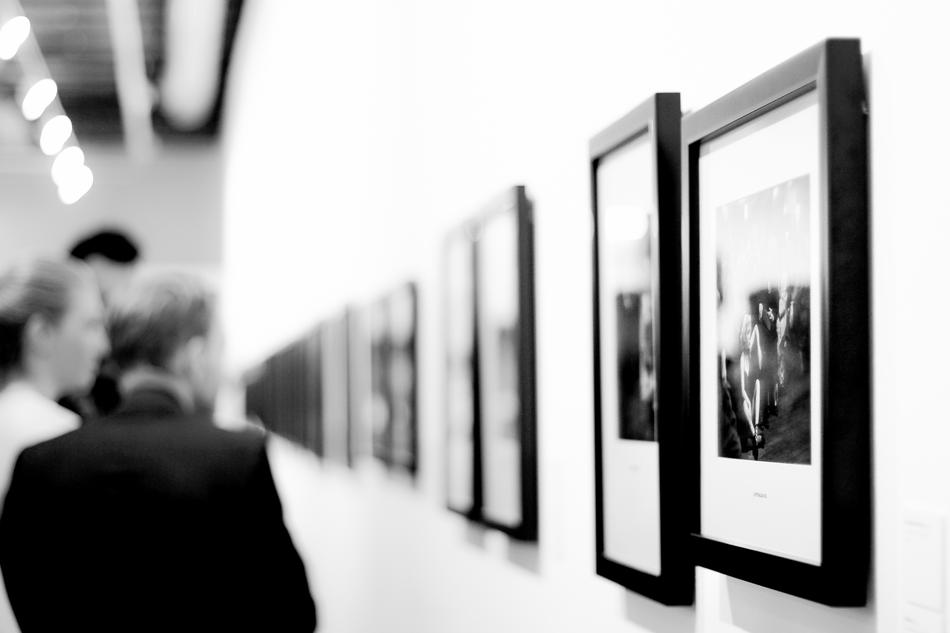 black and white photo of people in the museum of photographs