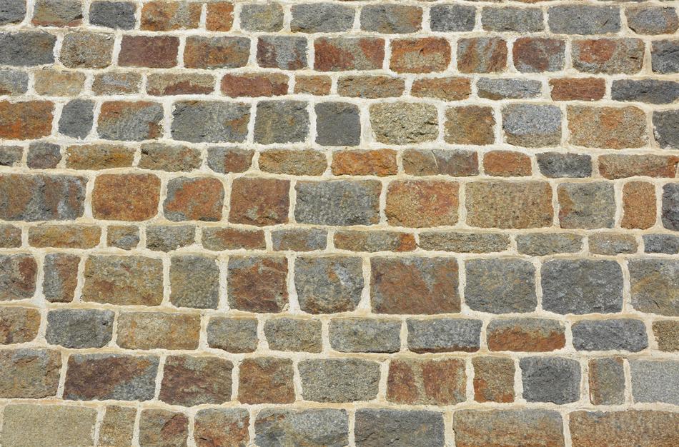 Close-up of the colorful stone wall of the church in Brittany, France