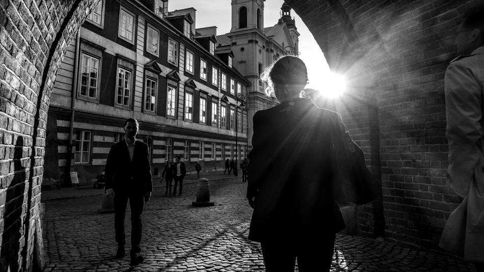 People in the beautiful city, in black and white colors, in light