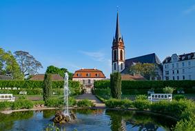 Beautiful and colorful Prince Georgs-Garden with the fountain, among the colorful buildings, in Darmstadt, Hesse, Germany