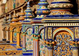 blue ceramic name on an old building in Seville, Spain