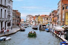 Boats and gondolas in the channel in beautiful Venice, Italy