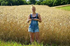 landscape of Beautiful Girl and Beauty wheat field
